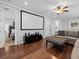 Home movie room with a large screen and comfortable seating at 733 Desert Mountain Ct, Reunion, FL 34747