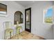 This patio is well-lit and offers a cozy seating area near the front door at 733 Desert Mountain Ct, Reunion, FL 34747