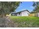 Spacious backyard with grassy area and wooden fence at 8607 Tarragon Dr, Orlando, FL 32825