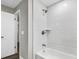 Clean bathroom with a shower/tub combo and white tile at 8607 Tarragon Dr, Orlando, FL 32825