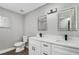 Updated bathroom with double vanity and modern fixtures at 8607 Tarragon Dr, Orlando, FL 32825