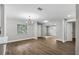 Spacious dining area with hardwood floors and a chandelier at 8607 Tarragon Dr, Orlando, FL 32825