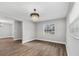 Bright dining room with hardwood floors and a chandelier at 8607 Tarragon Dr, Orlando, FL 32825