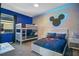 bedroom with full-size bed, bunk beds, and Mickey Mouse decor at 8879 Cabot Cliffs Dr # 103, Davenport, FL 33896