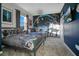 Themed bedroom with twin beds, Star Wars mural, and ample closet space at 8879 Cabot Cliffs Dr # 103, Davenport, FL 33896