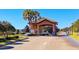 Gated community entrance with guard house at 8879 Cabot Cliffs Dr # 103, Davenport, FL 33896