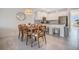 Modern kitchen with white cabinets, granite counters, and stainless steel appliances at 8879 Cabot Cliffs Dr # 103, Davenport, FL 33896