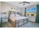 Spacious main bedroom with a king-size bed and calming decor at 8879 Cabot Cliffs Dr # 103, Davenport, FL 33896