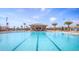 Community lap pool with a relaxing cabana at 8879 Cabot Cliffs Dr # 103, Davenport, FL 33896