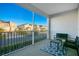 Enjoy peaceful views from this screened balcony with comfy seating at 8879 Cabot Cliffs Dr # 103, Davenport, FL 33896