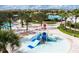 Community splash pad with slides and water features for children at 8879 Cabot Cliffs Dr # 103, Davenport, FL 33896