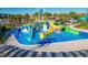 Colorful water play area with slides and sprinklers at 8879 Cabot Cliffs Dr # 103, Davenport, FL 33896