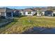 Aerial view showcasing homes with lanais near a pond at 1062 Umbria Dr, Kissimmee, FL 34759