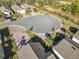 Aerial view of cul-de-sac with houses and palm trees at 1062 Umbria Dr, Kissimmee, FL 34759