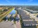 Aerial view of homes in a community near a canal at 1062 Umbria Dr, Kissimmee, FL 34759