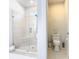 Bathroom with walk-in shower, toilet, and modern fixtures at 1062 Umbria Dr, Kissimmee, FL 34759