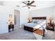 Spacious bedroom with ceiling fan and ensuite bathroom at 1062 Umbria Dr, Kissimmee, FL 34759