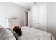 Bedroom with white dresser and a queen-size bed at 1062 Umbria Dr, Kissimmee, FL 34759