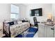 Guest bedroom with daybed, workspace, and TV at 1062 Umbria Dr, Kissimmee, FL 34759