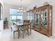 Elegant dining room with a chandelier and large hutch at 1062 Umbria Dr, Kissimmee, FL 34759