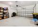 Spacious garage with ample storage shelving and overhead storage at 1062 Umbria Dr, Kissimmee, FL 34759