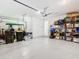 Two-car garage with extra storage space and golf cart at 1062 Umbria Dr, Kissimmee, FL 34759