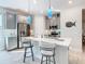 Modern kitchen with stainless steel appliances and island at 1062 Umbria Dr, Kissimmee, FL 34759