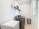 Laundry room with washer, dryer, and overhead shelving at 1062 Umbria Dr, Kissimmee, FL 34759