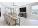 Spacious living room featuring a large TV and comfortable seating at 1062 Umbria Dr, Kissimmee, FL 34759