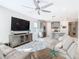 Open living area with large TV and kitchen views at 1062 Umbria Dr, Kissimmee, FL 34759