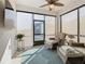 Relaxing sunroom with wicker furniture and ceiling fan at 1062 Umbria Dr, Kissimmee, FL 34759