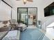 Sunroom with sliding glass doors and wicker furniture at 1062 Umbria Dr, Kissimmee, FL 34759