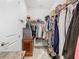 Large walk-in closet with custom shelving and drawers at 1062 Umbria Dr, Kissimmee, FL 34759