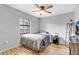 Bedroom with a bed, TV, and wood floors at 110 Talavera Ln, Kissimmee, FL 34758