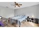 Bedroom with a striped bed and wood floors at 110 Talavera Ln, Kissimmee, FL 34758