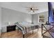 Bright bedroom with a striped bed and wood floors at 110 Talavera Ln, Kissimmee, FL 34758