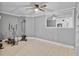 Exercise room with elliptical, weight machine, and mirror at 110 Talavera Ln, Kissimmee, FL 34758