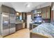 Modern kitchen with stainless steel appliances and granite countertops at 110 Talavera Ln, Kissimmee, FL 34758