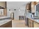 Modern kitchen with stainless steel appliances and granite countertops at 110 Talavera Ln, Kissimmee, FL 34758