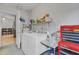 Laundry room with washer, dryer, and storage at 110 Talavera Ln, Kissimmee, FL 34758