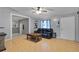 Living room with black leather couch, coffee table, and ceiling fan at 110 Talavera Ln, Kissimmee, FL 34758