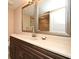 Elegant bathroom with a double vanity and large mirrors at 12414 Baleria Cv # 108, Orlando, FL 32837