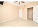 Spacious bedroom with tile floors, ceiling fan, and ample closet space at 12414 Baleria Cv # 108, Orlando, FL 32837