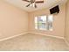 Spacious bedroom with tiled floors and large windows at 12414 Baleria Cv # 108, Orlando, FL 32837