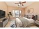 Main bedroom with ceiling fan and large windows at 12414 Baleria Cv # 108, Orlando, FL 32837