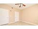 Well-lit bedroom featuring tile floors and double closets at 12414 Baleria Cv # 108, Orlando, FL 32837