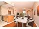 Elegant dining area with hardwood floors and a marble top table at 12414 Baleria Cv # 108, Orlando, FL 32837