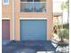 Private garage with teal door and convenient exterior access at 12414 Baleria Cv # 108, Orlando, FL 32837