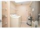 Convenient laundry room with washer, dryer, shelving, and water heater at 12414 Baleria Cv # 108, Orlando, FL 32837