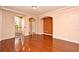 Living room features hardwood floors and access to balcony at 12414 Baleria Cv # 108, Orlando, FL 32837